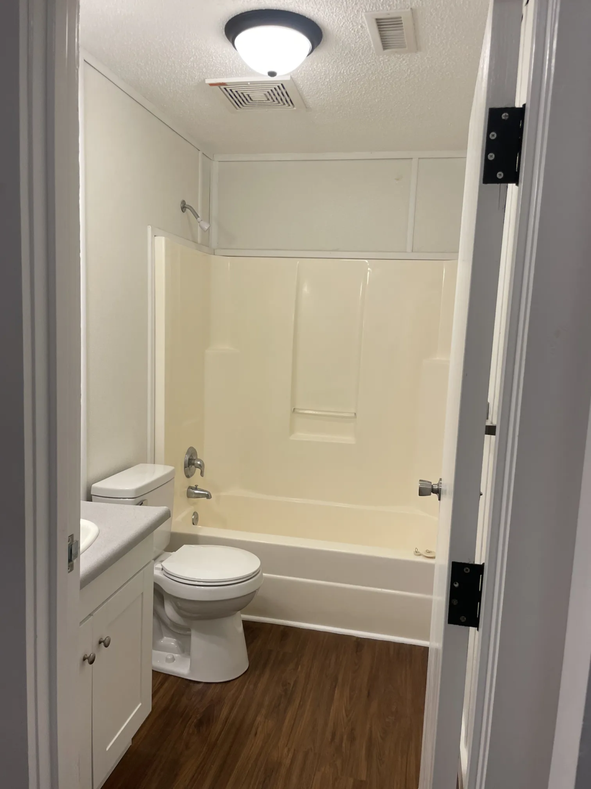 This cozy and functional bathroom features neutral colors and fixtures that create a serene and calming atmosphere.