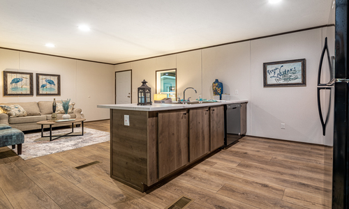 A beautifully designed kitchen and living room area, perfect for entertaining guests or relaxing after a long day.