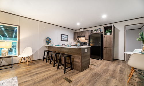 A kitchen that boasts modern appliances and sleek countertops.
