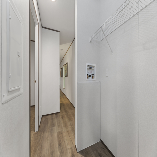 This hallway is spacious, providing room for storage and decoration.